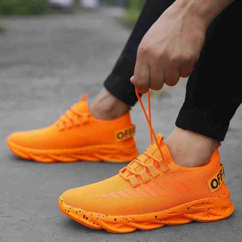 Orange color sneakers online