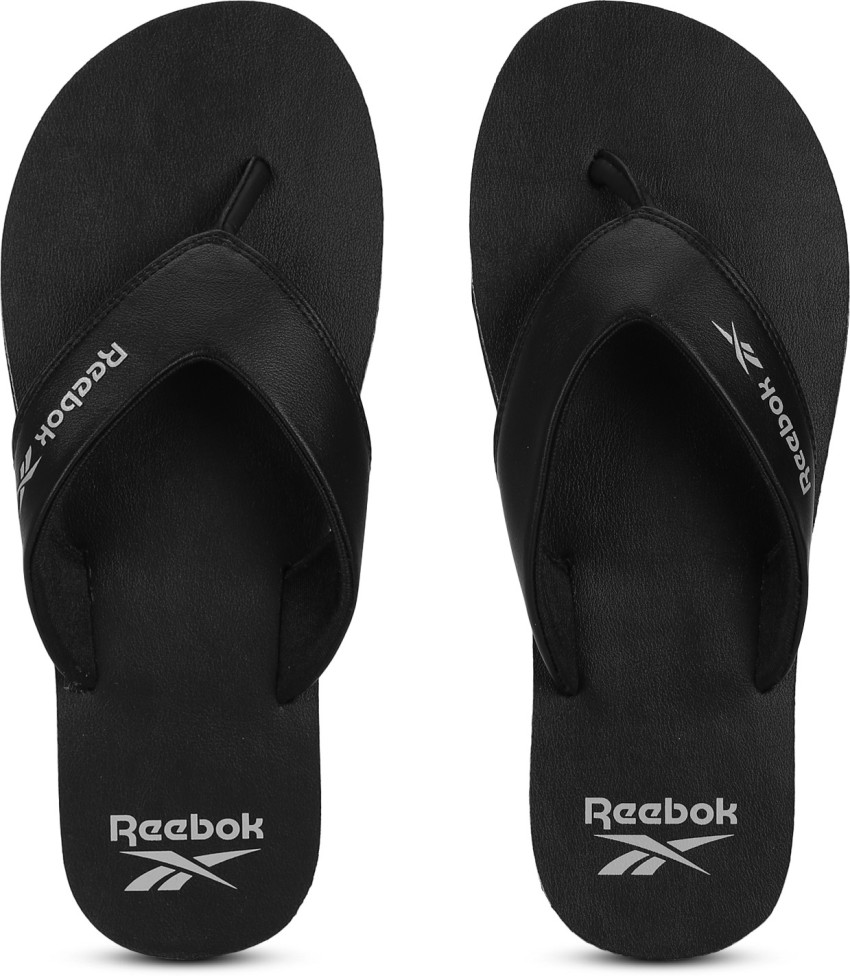 Black reebok store flip flops