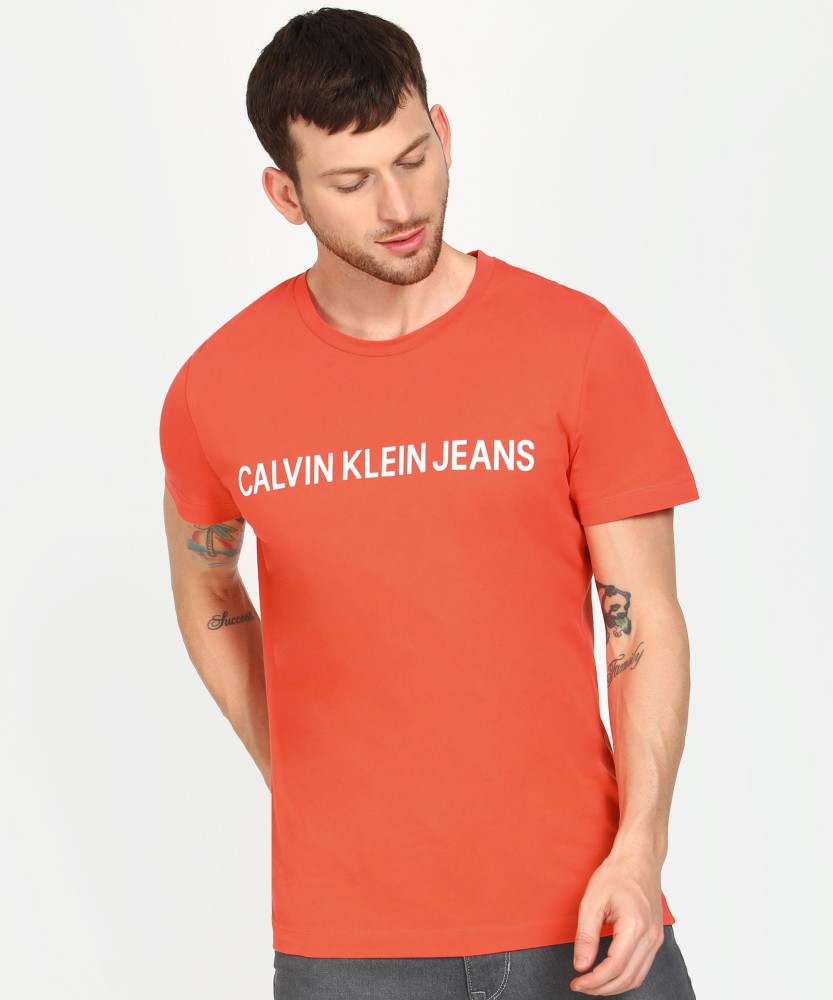 Online Prices T-Shirt Men T-Shirt Jeans at Klein Jeans India Klein Men Calvin in Printed Orange Printed Buy Best Orange - Calvin Round Round Neck Neck