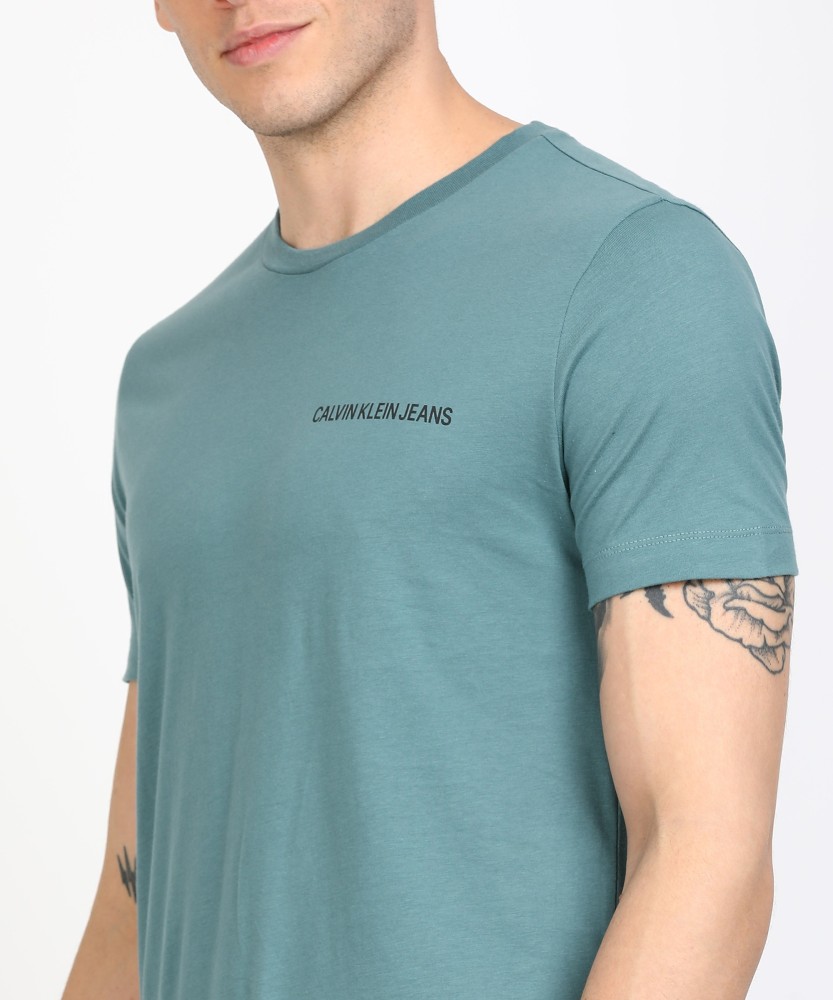 Calvin Klein Jeans Solid Men Round Neck Green T-Shirt - Buy Calvin Klein  Jeans Solid Men Round Neck Green T-Shirt Online at Best Prices in India