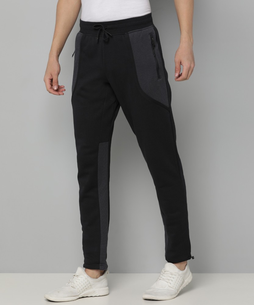 Buy UNDER ARMOUR Solid Men Black Track Pants Online at Best