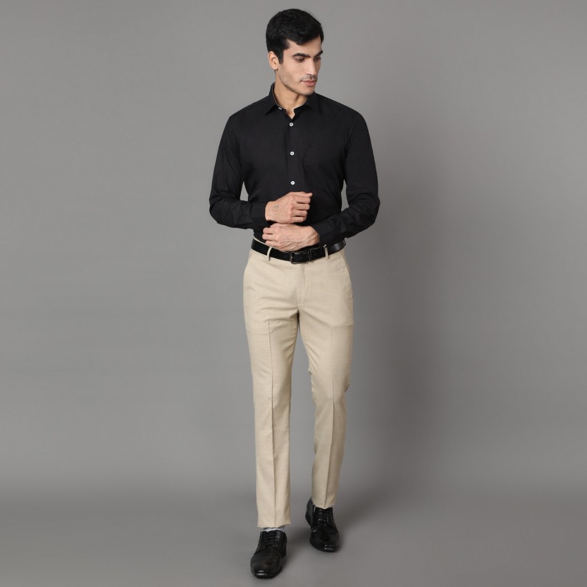 cream colour shirt and black pant