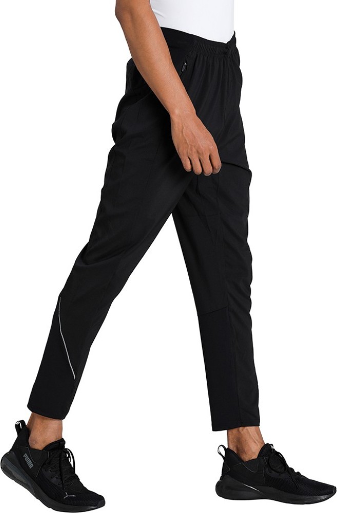 PUMA RUN WOVEN TAPERED PANT Solid Men Black Track Pants - Buy PUMA