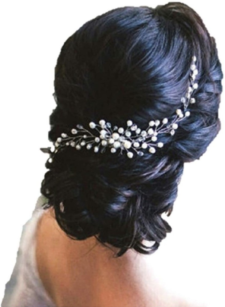 Premium Photo  Close-up of the bride's hairstyle. curls. jewelry with pearls  for hair. wedding ceremony. preparatio