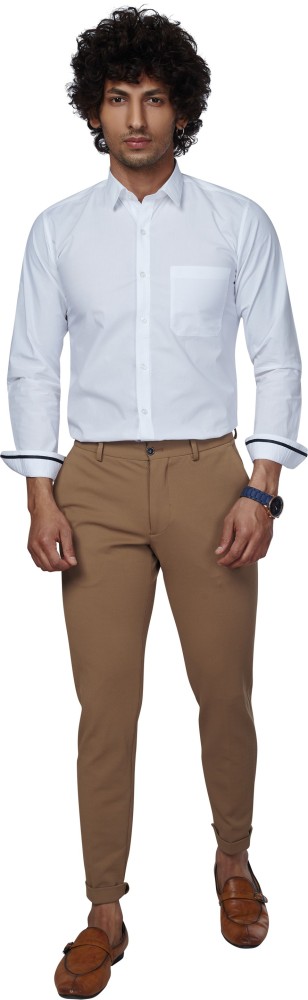 Men's White Long Sleeve Shirt, Khaki Chinos, White Canvas Low Top Sneakers,  Brown Suede Belt | Lookastic