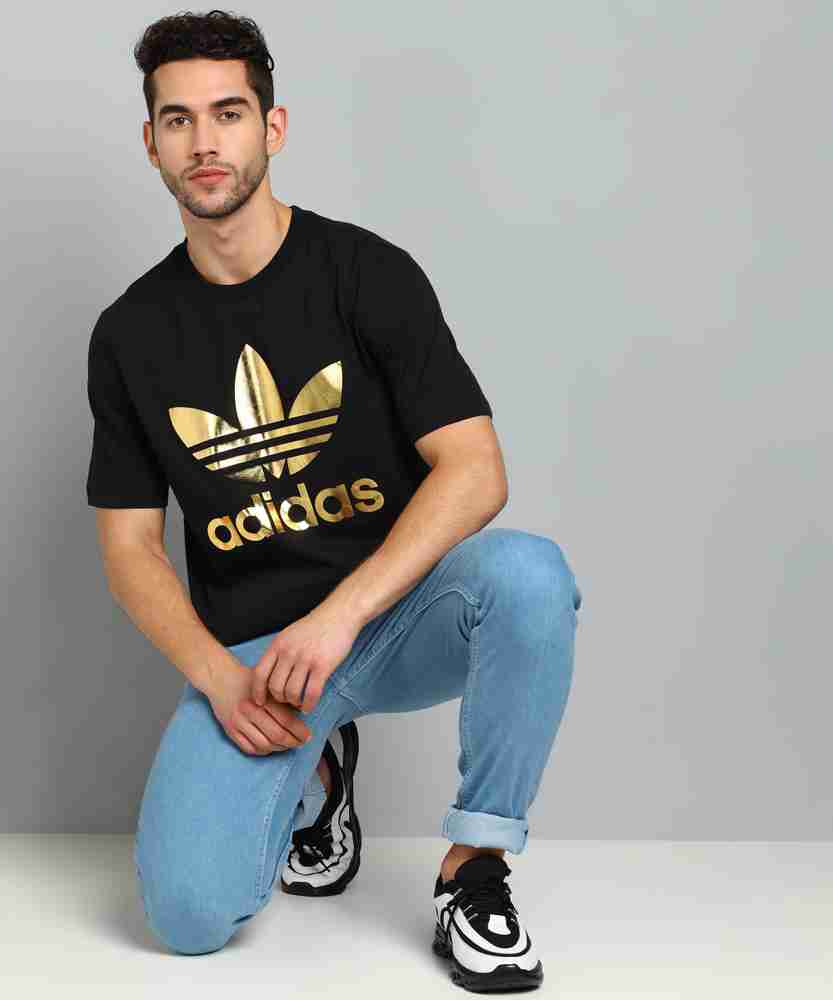 Adidas black shop and gold shirt