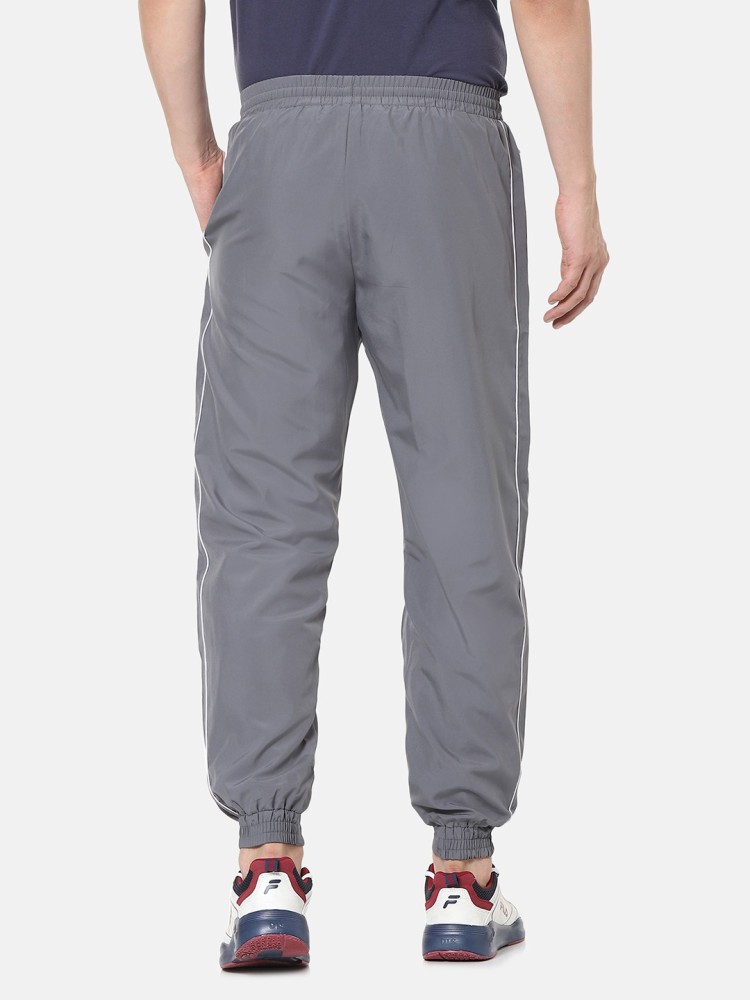 Grey lacoste store guppy track pants