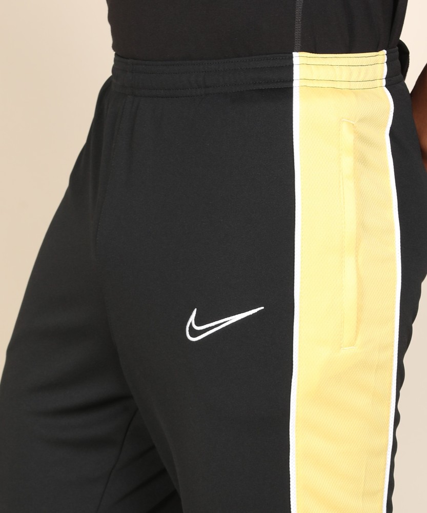 Nike black and hotsell gold pants