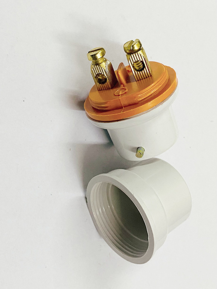 Bulb holder pin outlet