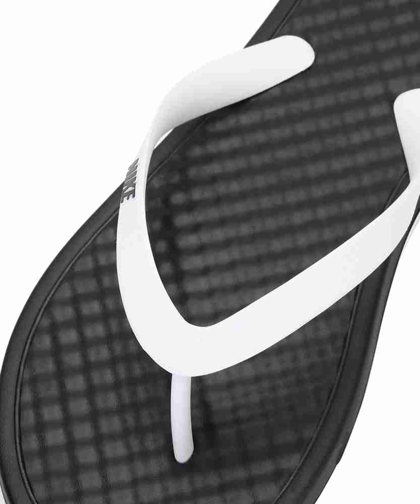 Black and white cheap nike flip flops