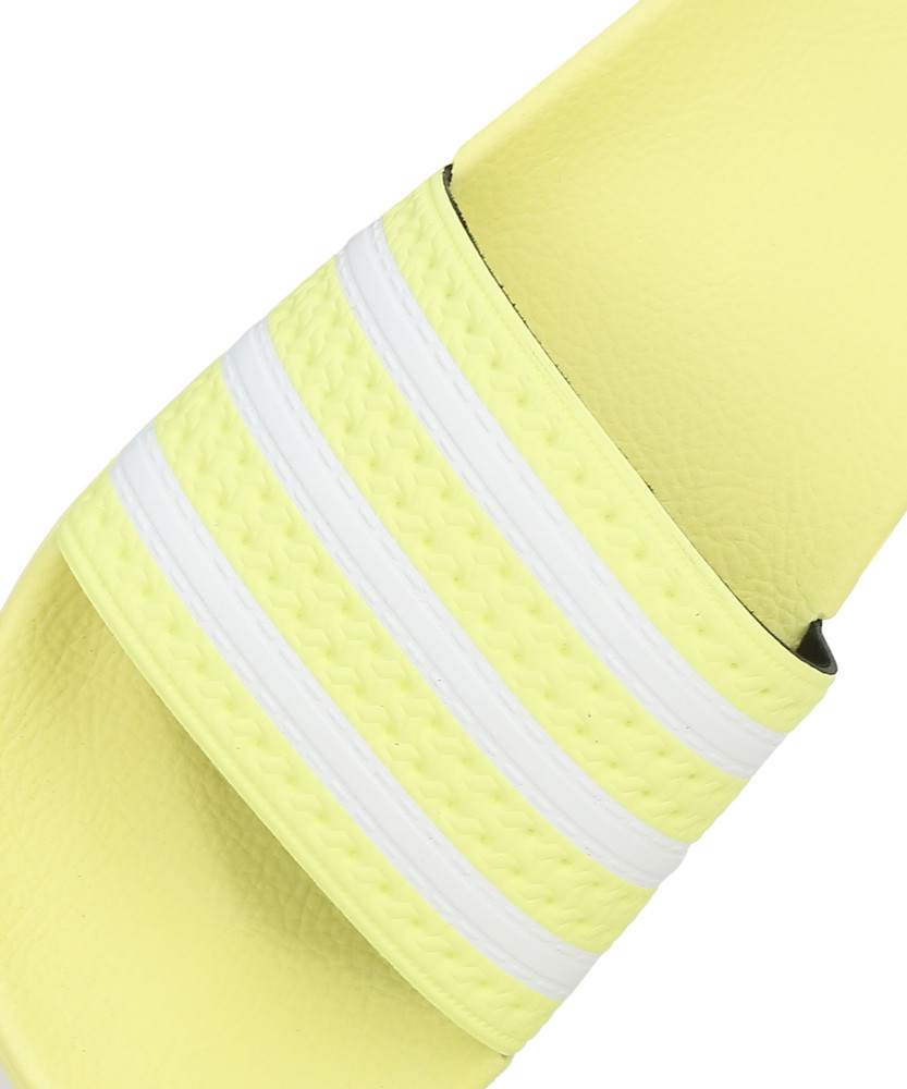Adidas store yellow slides