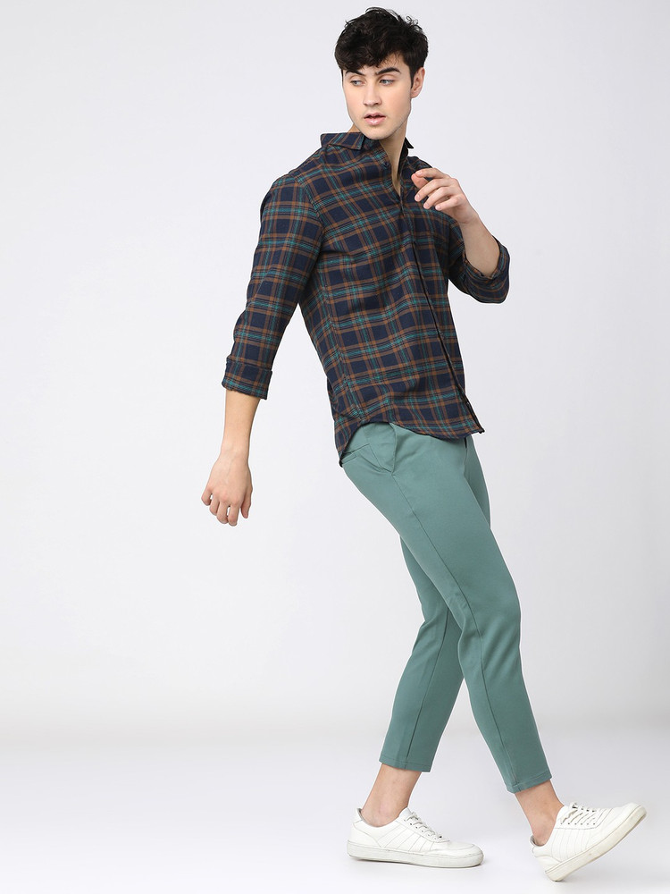 navy blue shirt and grey pants