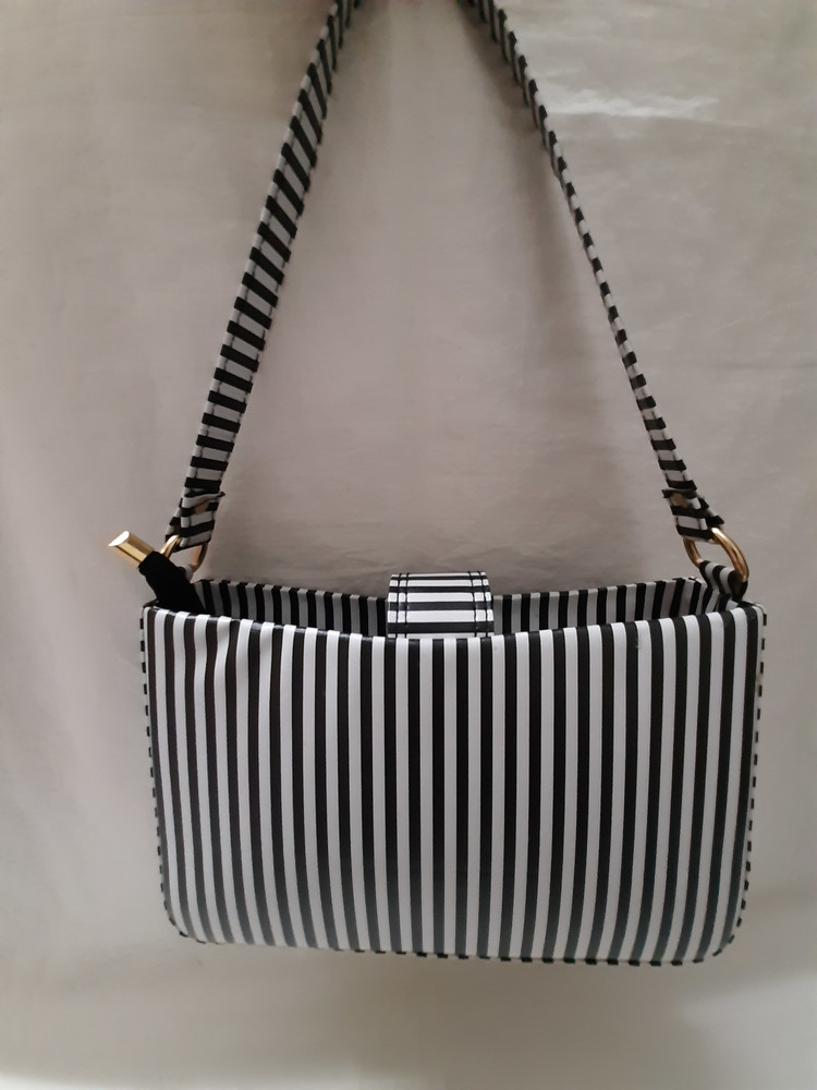 Black and cheap white striped clutch