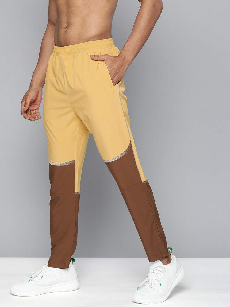 yellow nike track pants