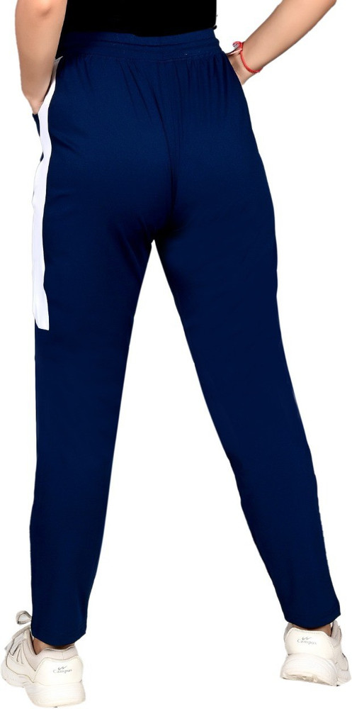 Blue track pants with white stripe online