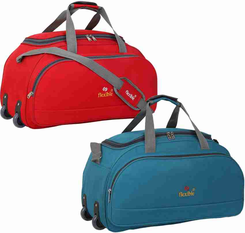 Travel bag with wheels and handle outlet