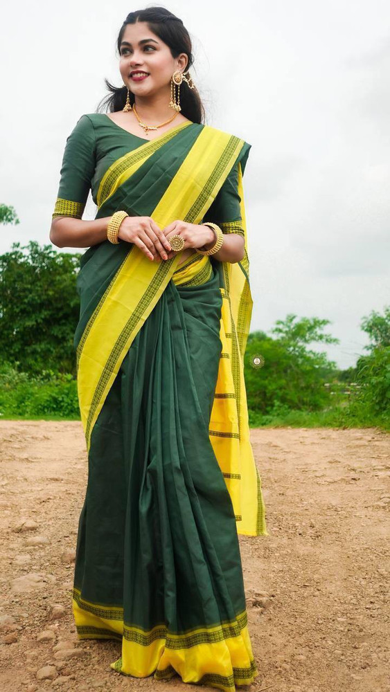 dark green saree with yellow border