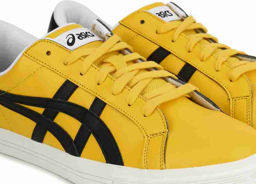 Asics black best sale and yellow shoes