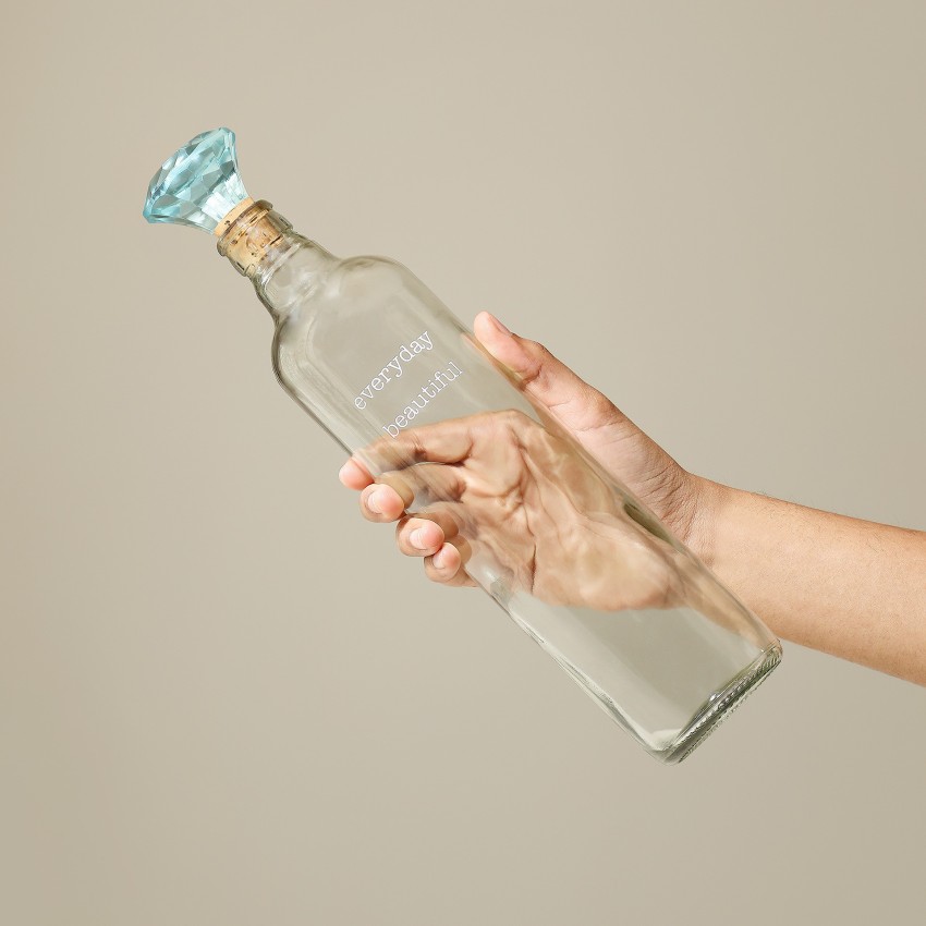 https://rukminim2.flixcart.com/image/850/1000/l08gsy80/bottle/v/l/n/750-everyday-glass-bottle-w-blue-glass-stopper-1-gstea2720-original-imagc2cg655gygn6.jpeg?q=90