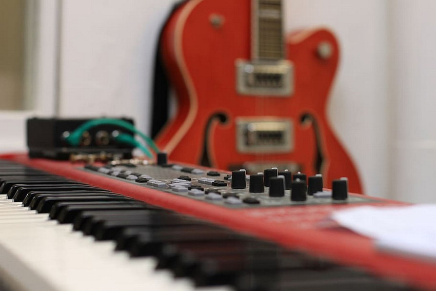 electric guitar semi acoustic guitar red guitar stage piano Paper