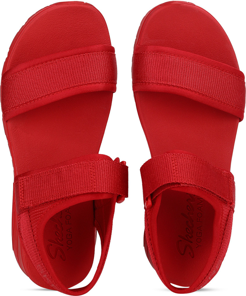 red sketcher sandals