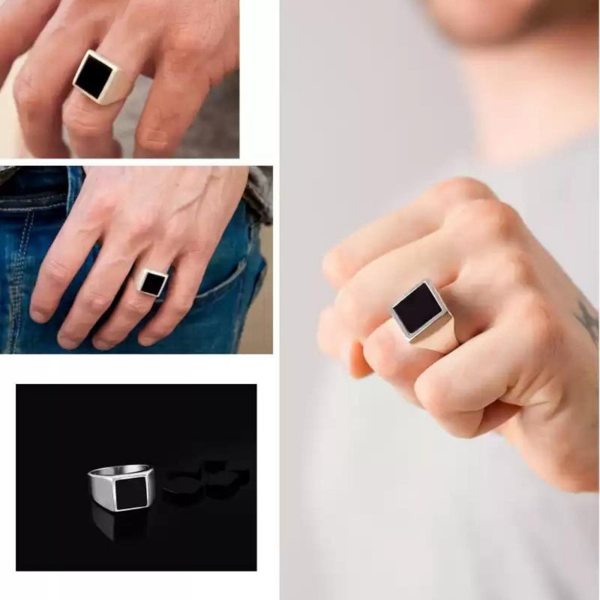 Black stone ring in which finger deals