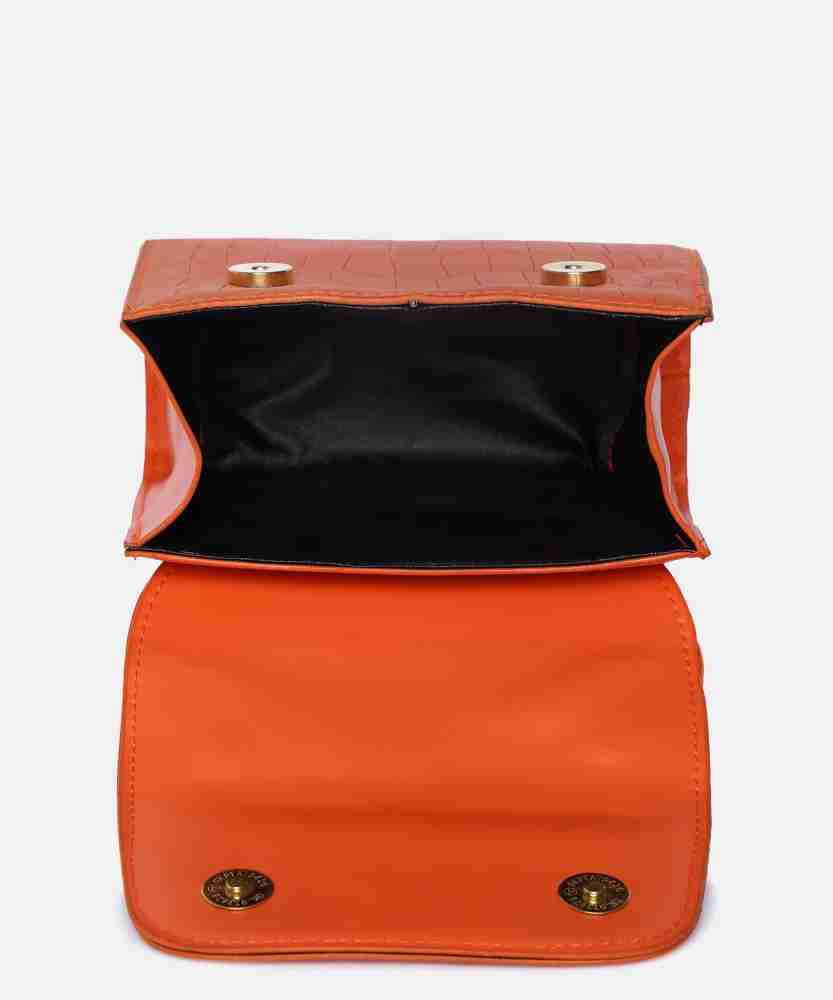 Haute Sauce Orange Sling Bag Solid Magnet Lock Sling Bag with Tie up detail  Orange - Price in India