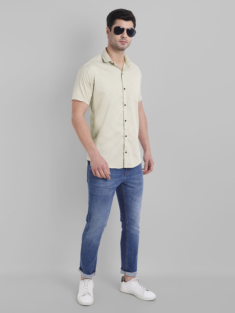 Cream shirt and sale blue jeans