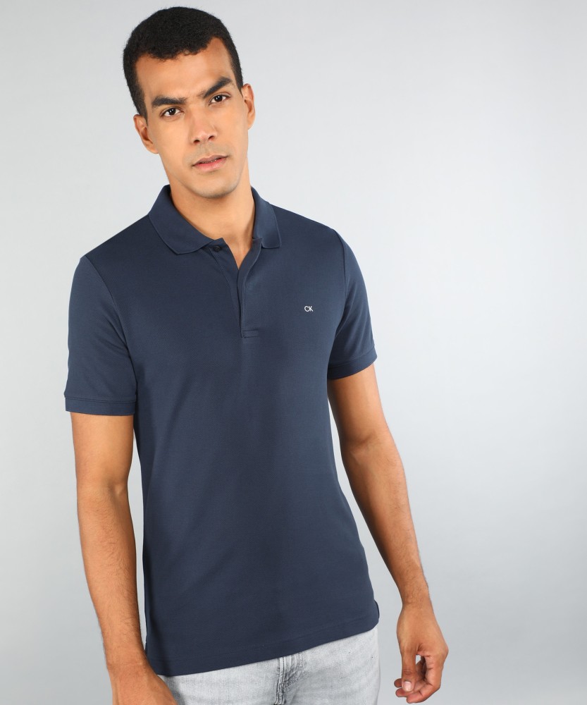 Calvin Klein Jeans Solid Men Polo Neck Blue T-Shirt - Buy Calvin Klein  Jeans Solid Men Polo Neck Blue T-Shirt Online at Best Prices in India