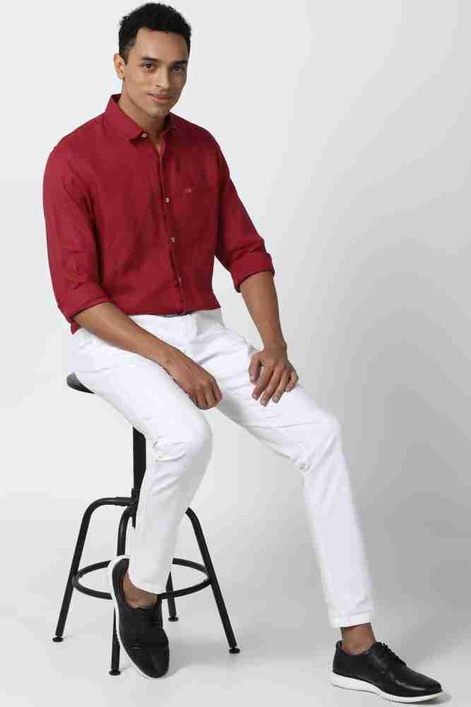 Red shirt white store jeans