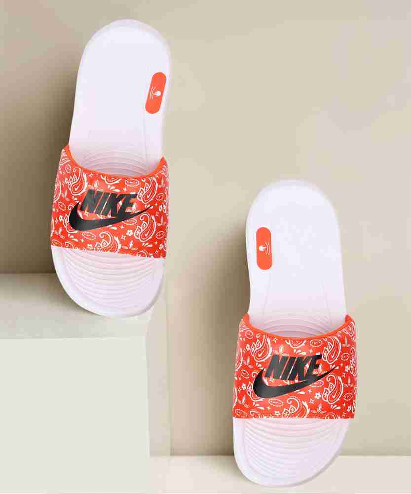 Orange and white best sale nike slides