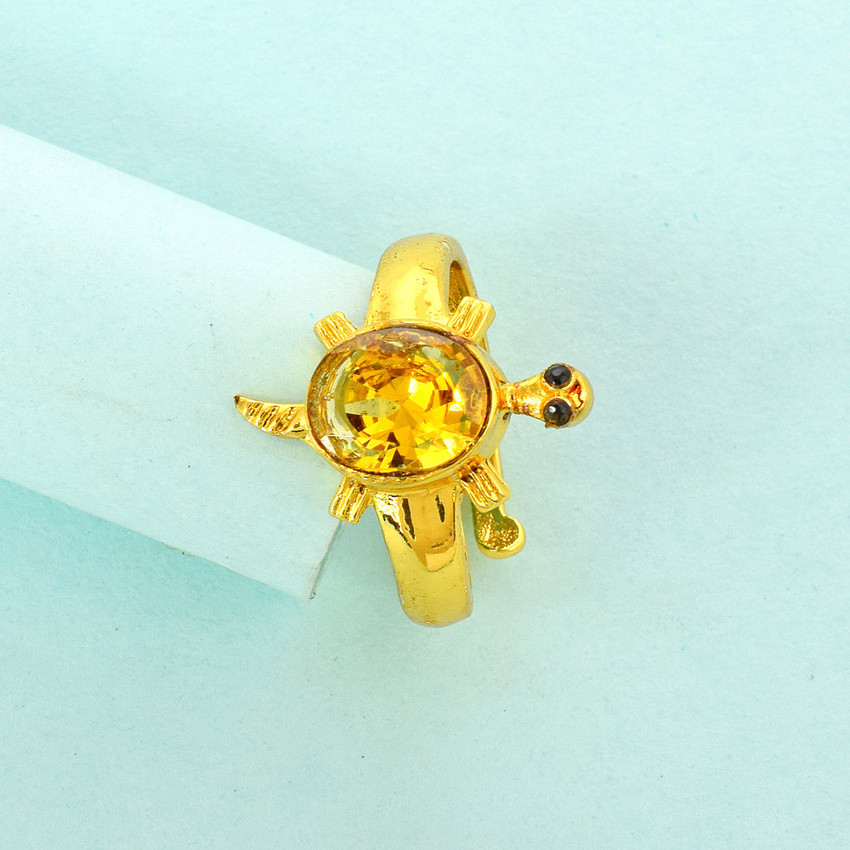 Tortoise ring with clearance yellow sapphire
