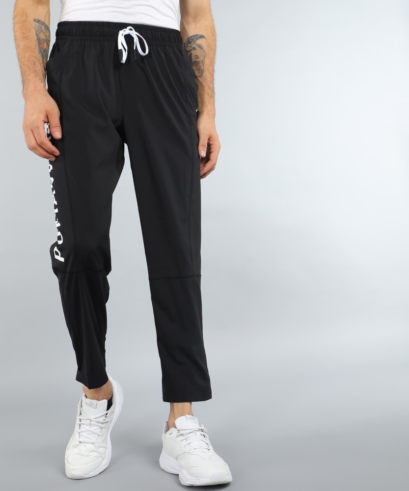 PUMA TRAIN LOGO WOVEN JOGGER Printed Men Black Track Pants Buy