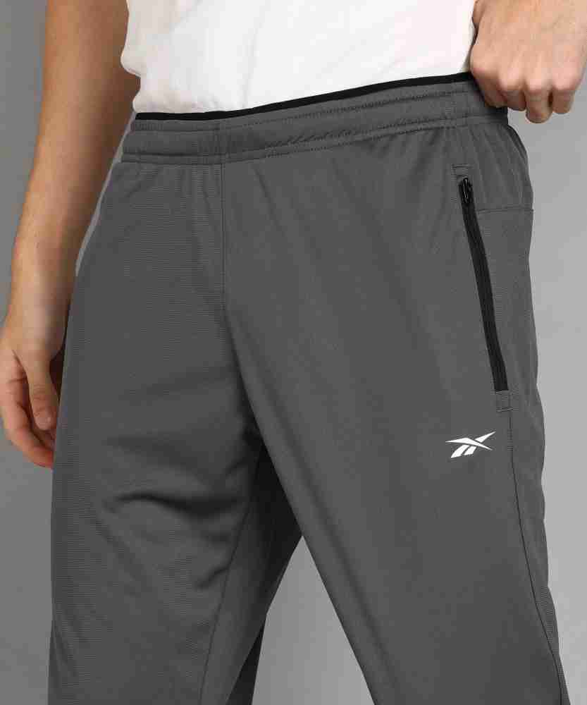 Mens sports pants Reebok WOR WOVEN PANT grey