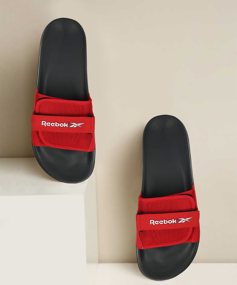 red reebok slides