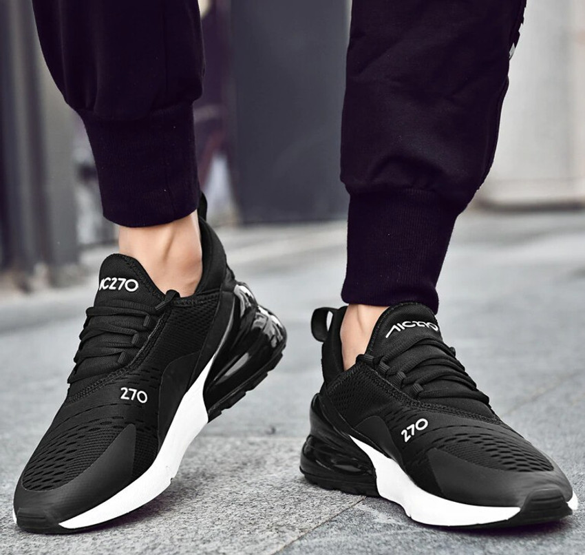 Sports shoes black and white on sale
