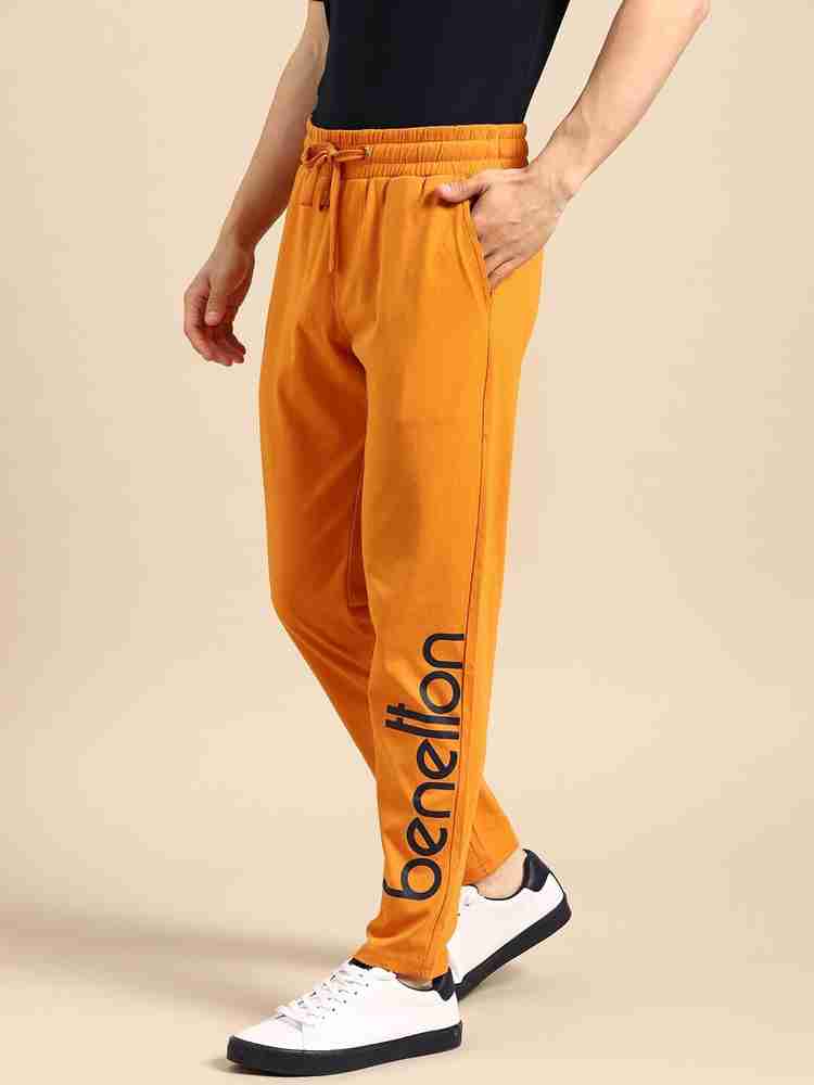 Orange track pants mens best sale