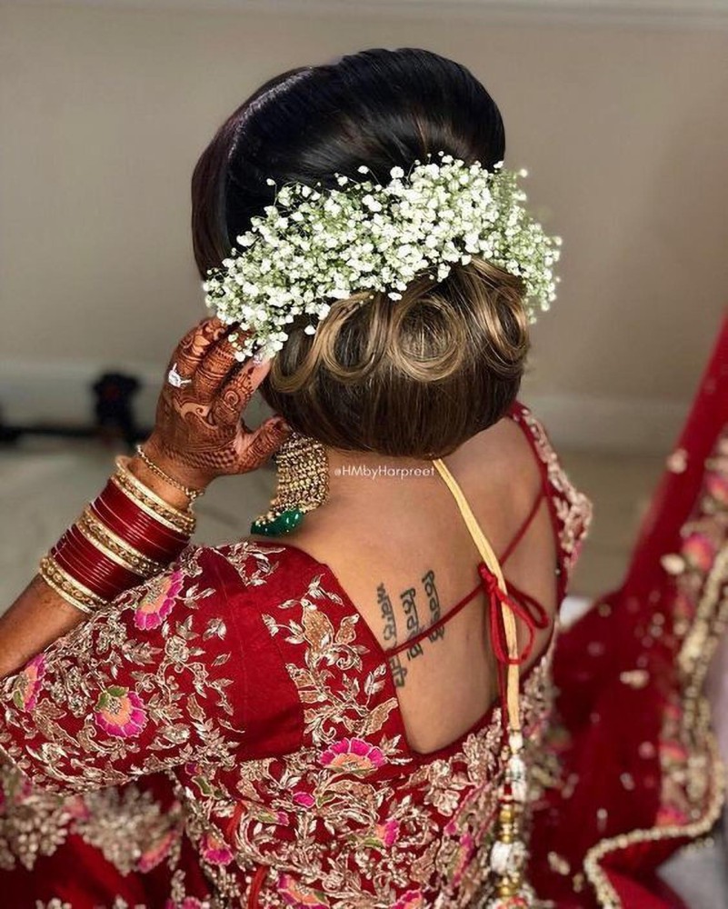 Rahul's Salon - Luxuriously designed 🤩🤩Bridal Wedding Bun Hairstyle with  flowers & Gajra Lovely and beautiful bridal hair 🌺🌺 for makeup bringing  you the beauty and serenity for your hair to look