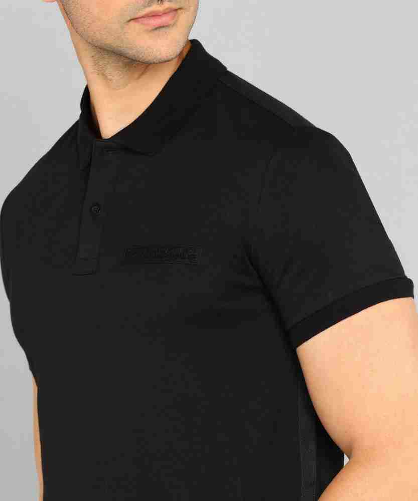 Calvin Klein Jeans Solid Men Polo Neck Black T-Shirt - Buy Calvin