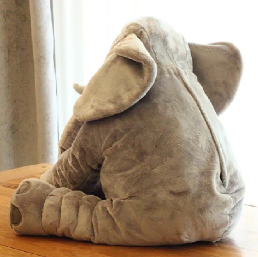 Baby sleeping on elephant pillow top