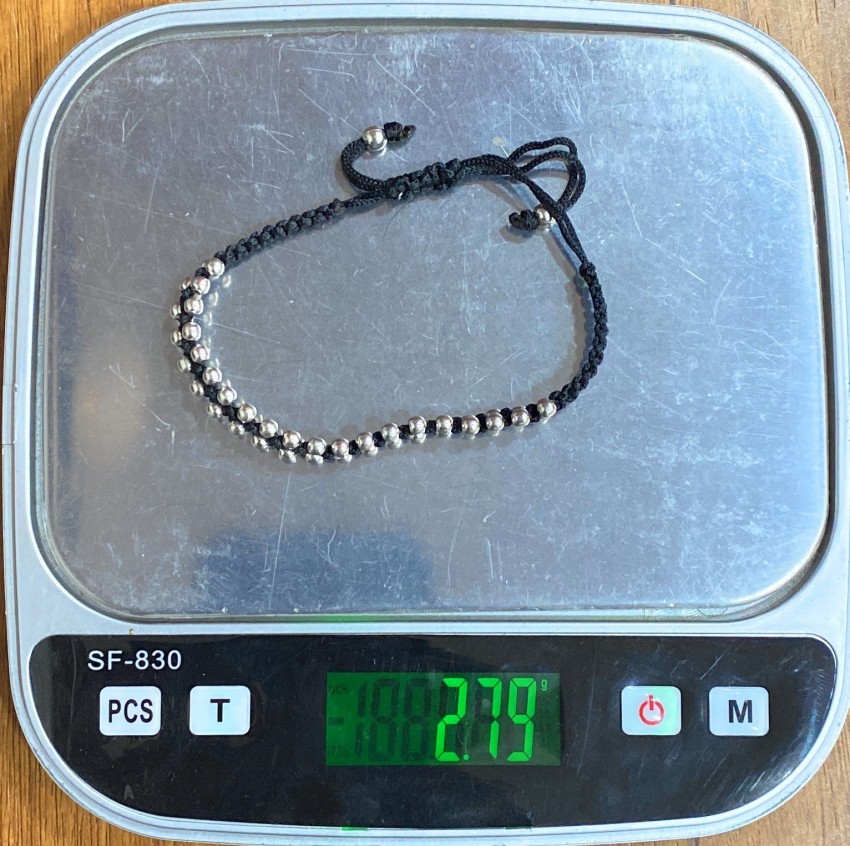 Silver bracelet with black on sale thread