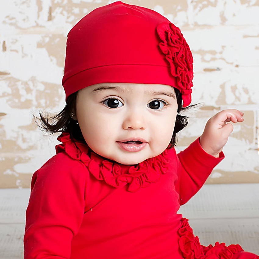 Baby with red dress on sale
