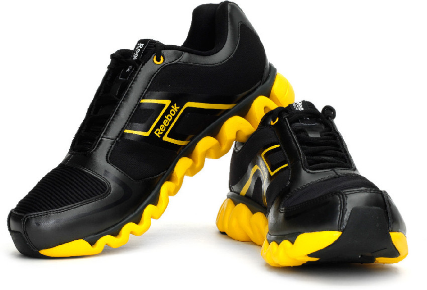 black and yellow reebok