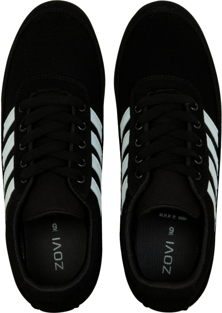 black trainers with white stripe