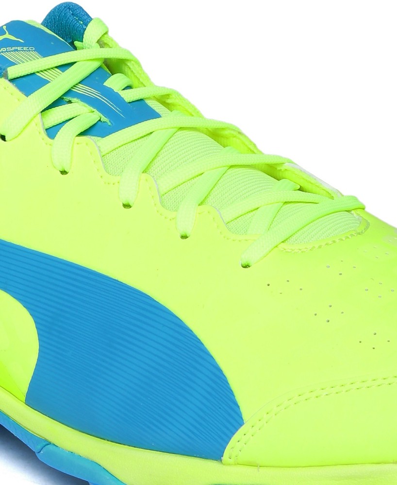 Puma pink fluorescent sales green cricket shoes