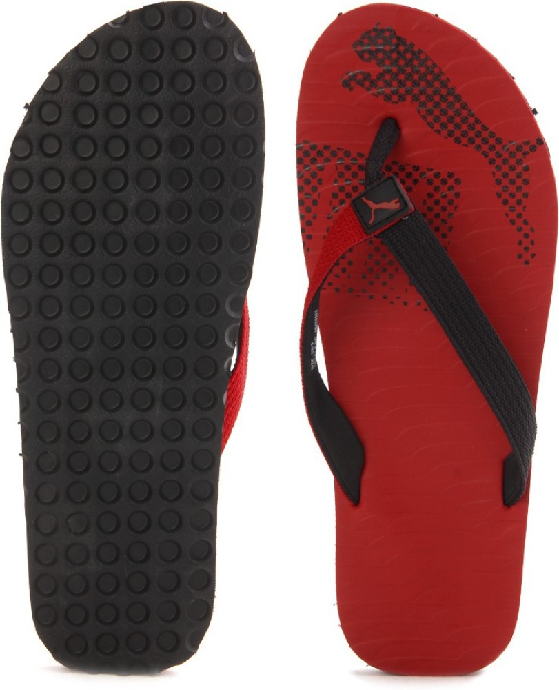 Puma red and shop black flip flops