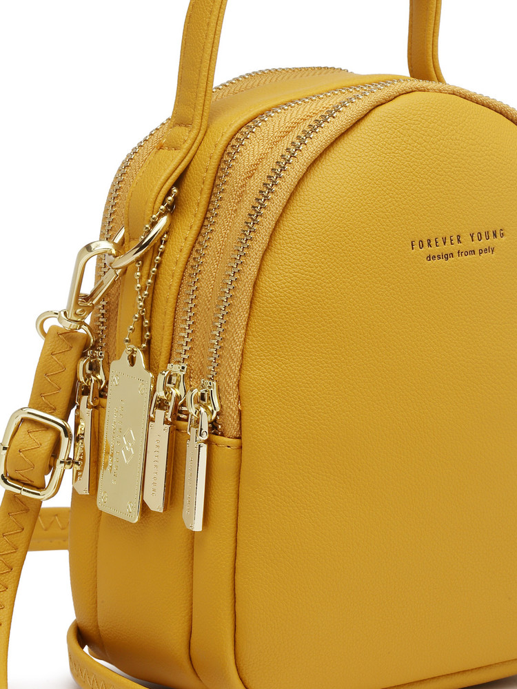 Yellow mini sales backpack purse