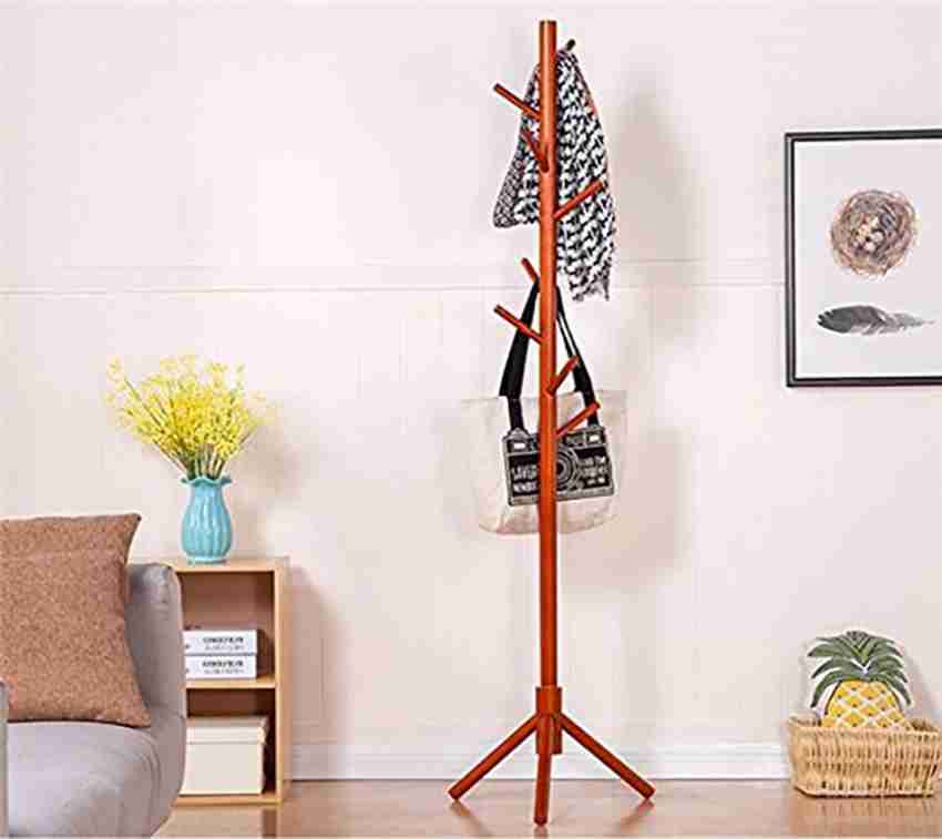 This stylish wooden coat rack has hooks that pivot out only when you need  them.