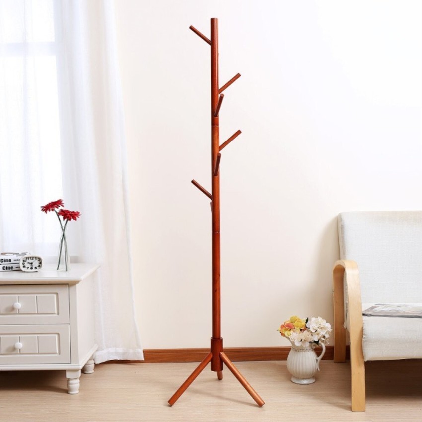 This stylish wooden coat rack has hooks that pivot out only when you need  them.