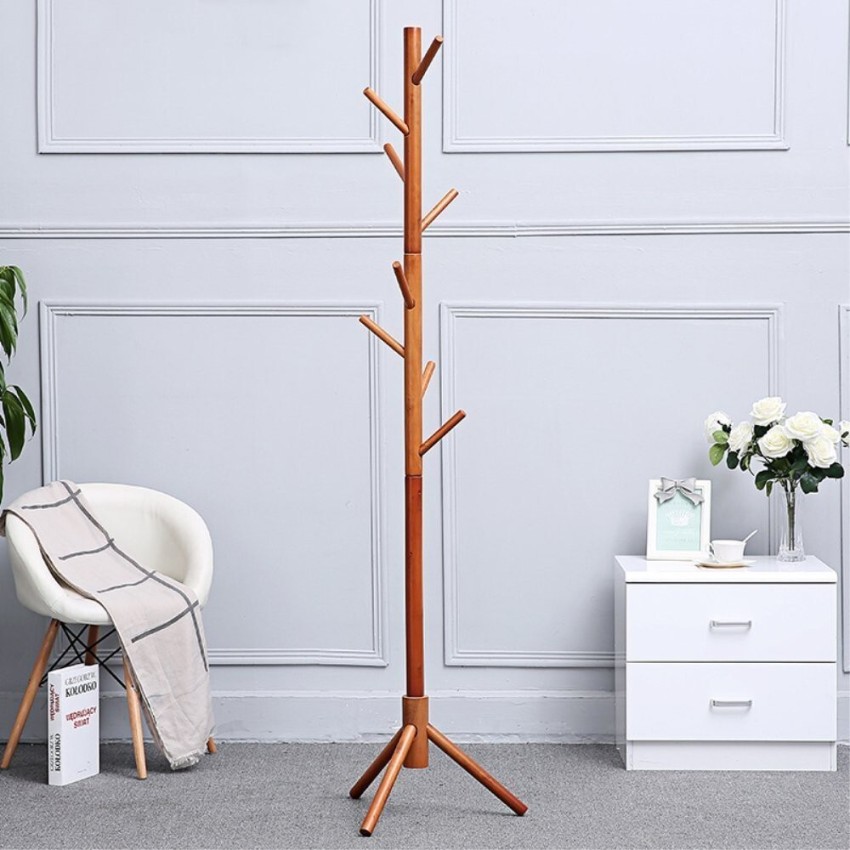 This stylish wooden coat rack has hooks that pivot out only when you need  them.